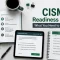 CISM study materials and digital practice exam setup with checklist and notebook.